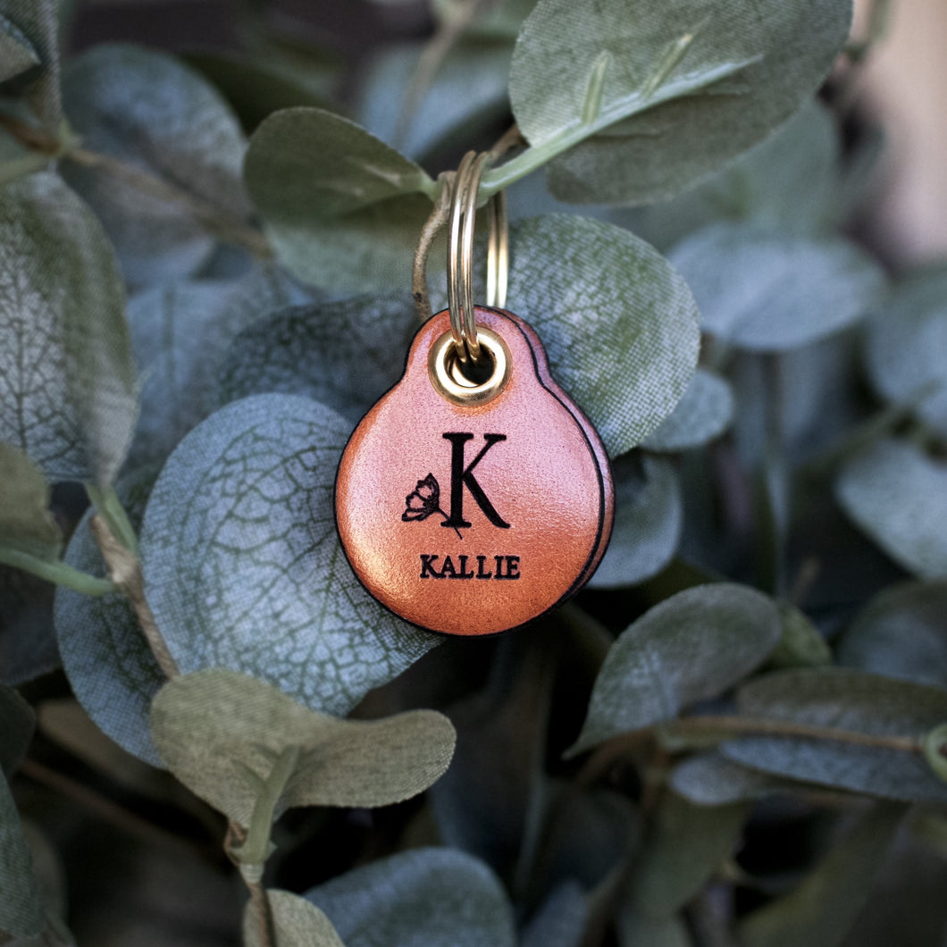 Miniature floral letter with name - saddle tan leather - double personalised dog tag
